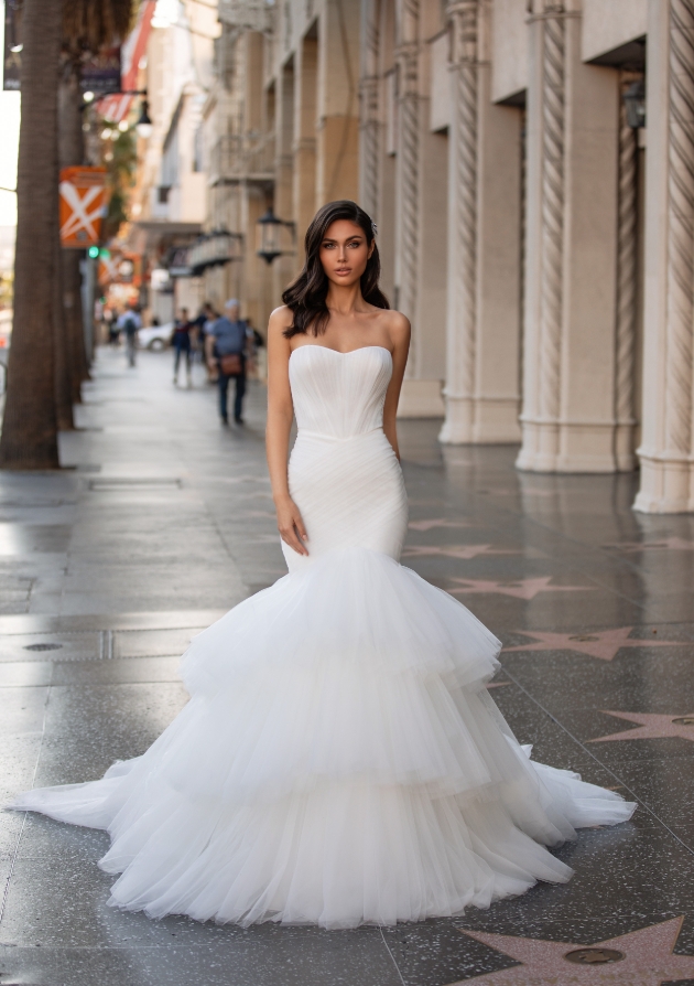 Model in the streets wearing a fishtail wedding dress