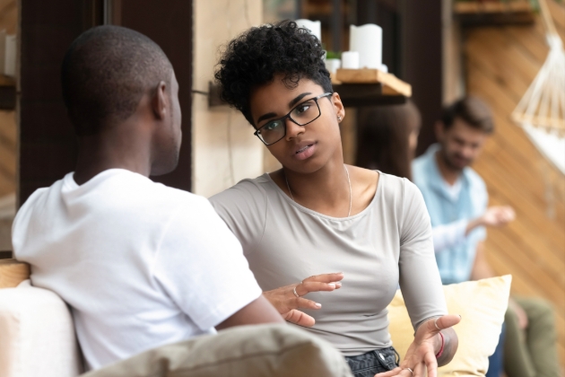 Female friend talking to a male friend 