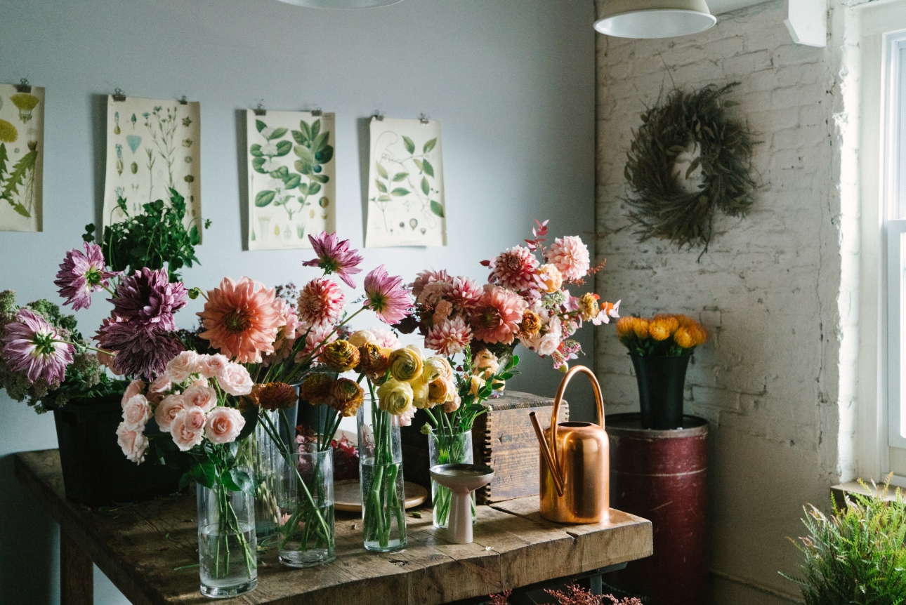 flower display of different flowers in different vases