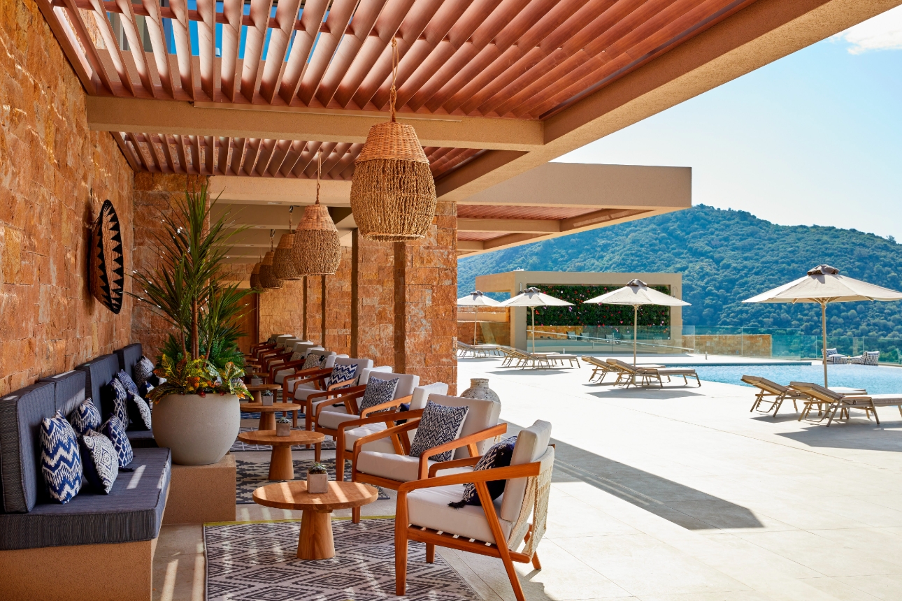 tables and chairs outside by pool