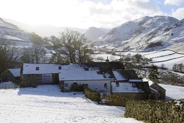 Farmhouse, in the hills covered in snow
