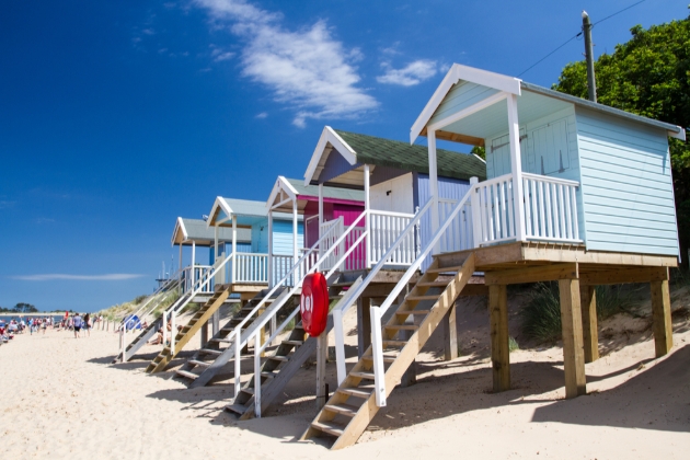 beach huts on the sand in norfolk