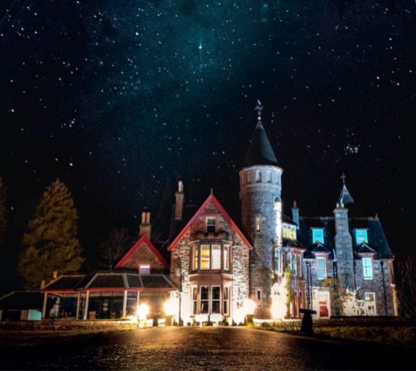 night time shot of castle-looking hotel