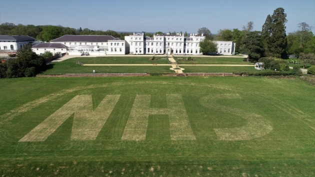 hotel with nhs mowed in the lawns outside