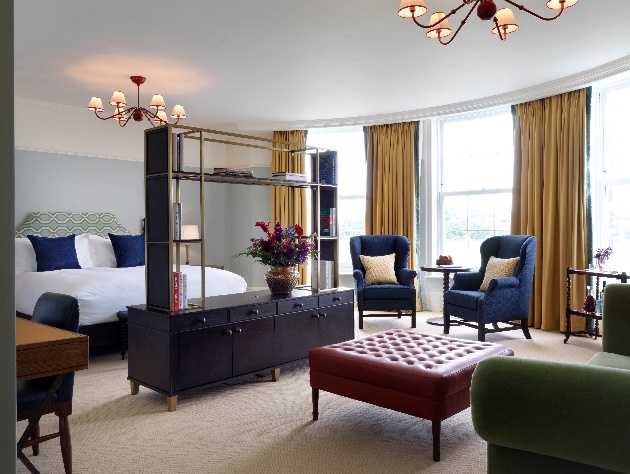 lucury bedroom king size bed with sofas in room
