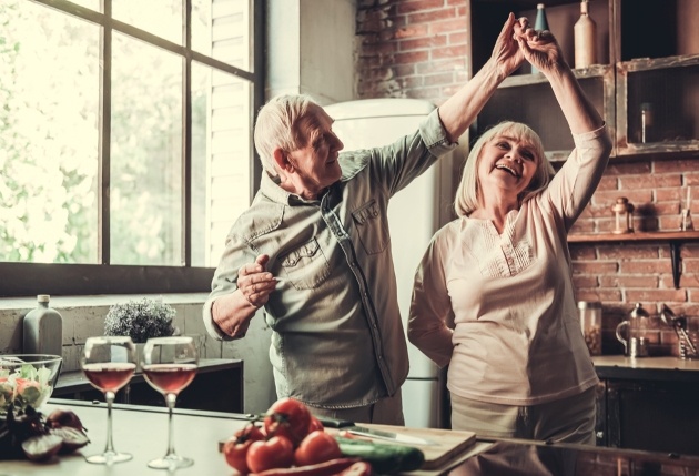 older couple dancing in kitchen