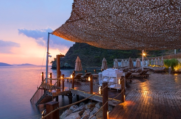 restaurant terrace at night looking out to ocean