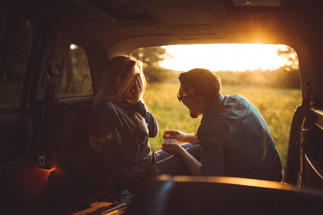 couple in back of car proposal