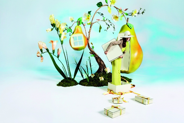 Jo Malone Pear and Freesia campaign imagery woman in yellow standing in box