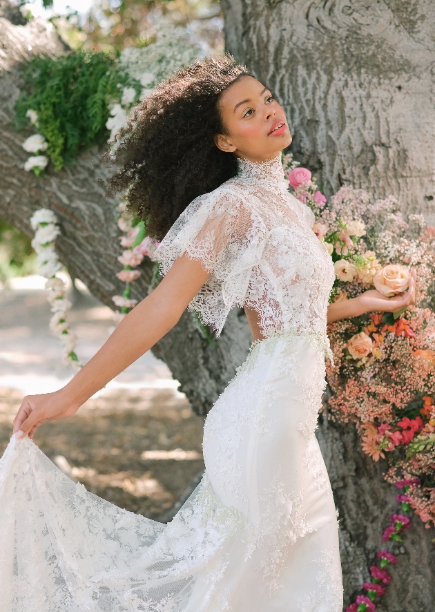 Model wearing lace dress with sleeves