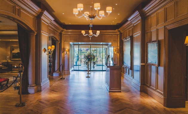 hotel reception featuring lots of oak panelled walls