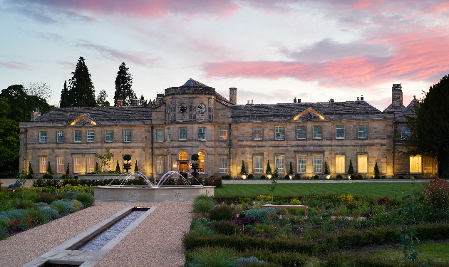 historic hotel lit up and sunset 