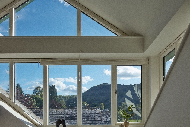 Stargazer room with large windows looking to the sky and binoculars 