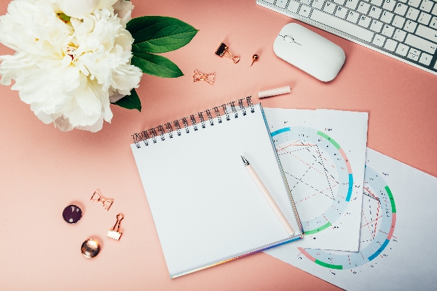 planner, pen, keyboard in a table with start charts