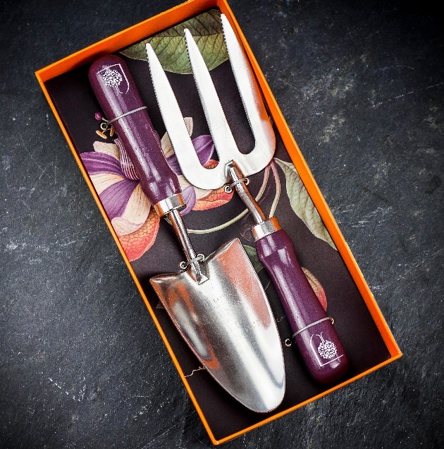 garden tools with purple wooden handles in a gift box