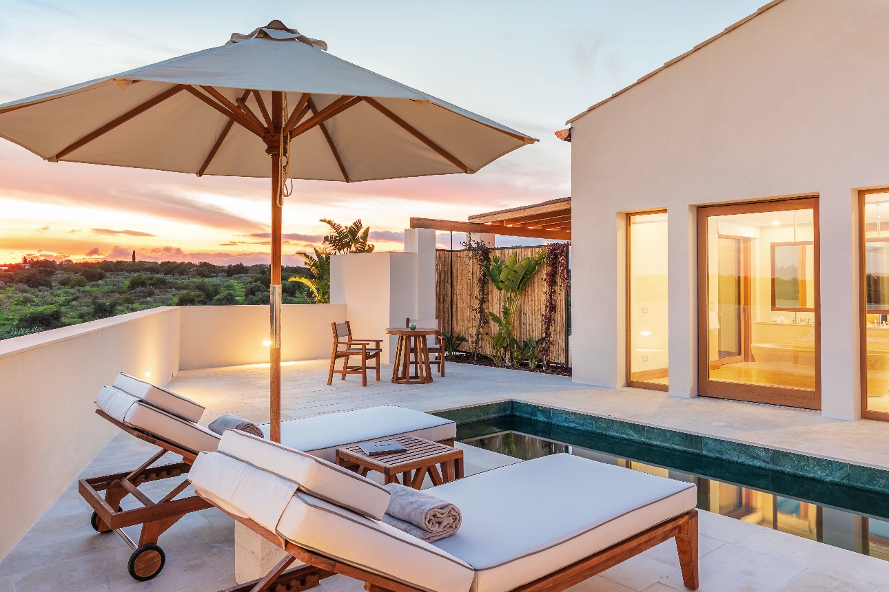 pool side villa with sunbeds
