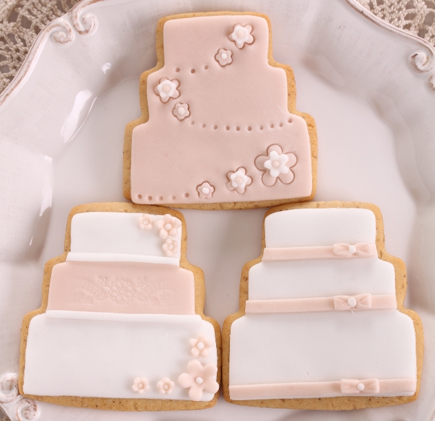 iced biscuits in shape of wedding cakes