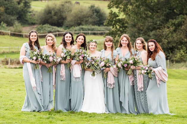 Bridesmaids and bride pose for photo
