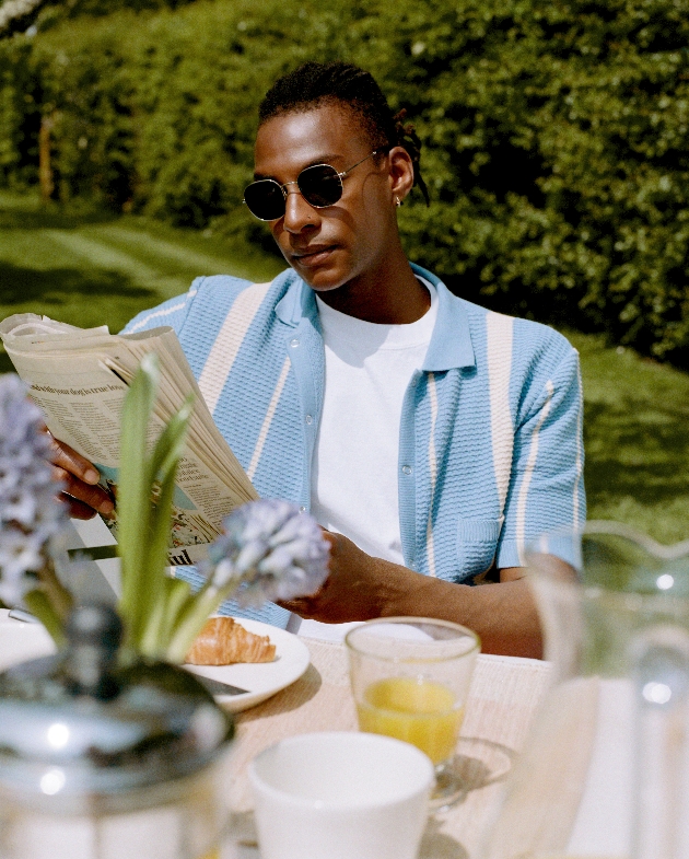 Man reading in summer clothes