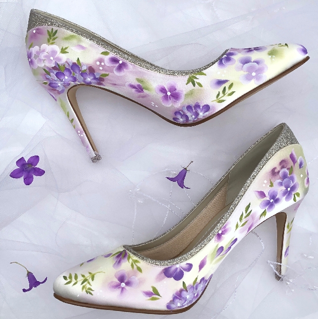 pair of painted shoes in a fairytale theme