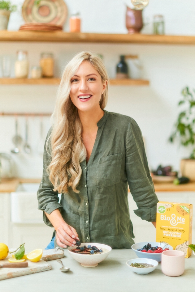 Dr Megan Rossi at a breakfast bar with lots of fruit and granola on it