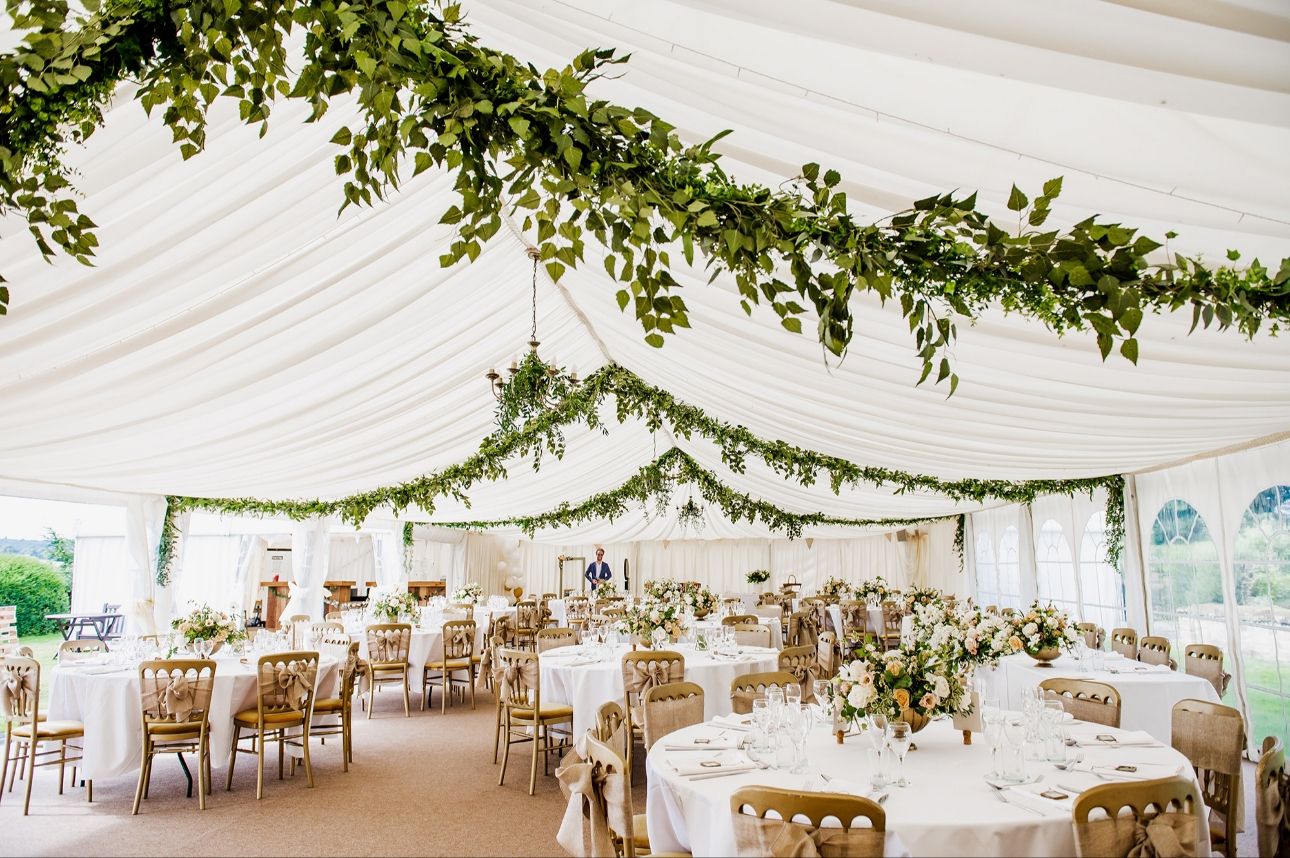Marquee decorated with green garlands