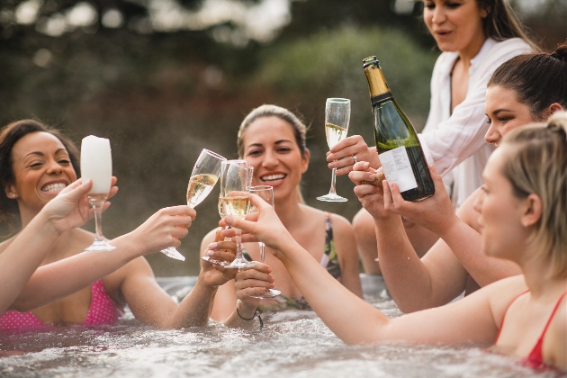 group of people in a spa tub