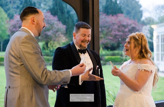 magician at a wedding breakfast with guests at tables