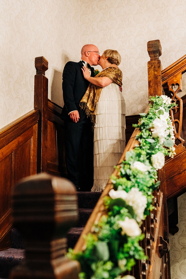 Couple kissing on staircase