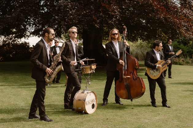 four piece band playing outside