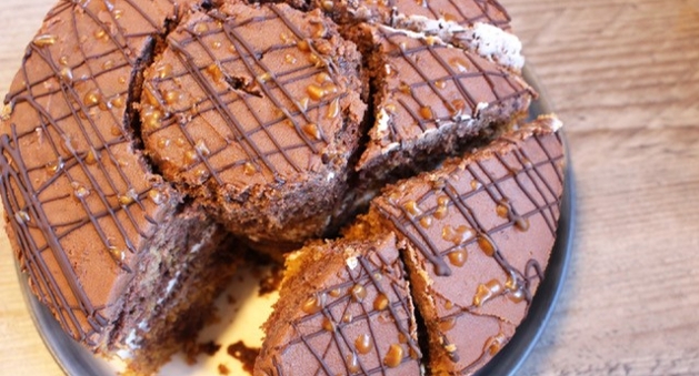 chocolate iced cake cut in all different shapes