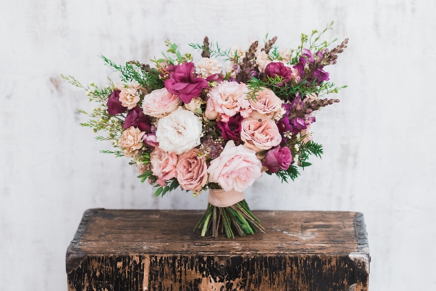 bouquet of flowers on wooden stand