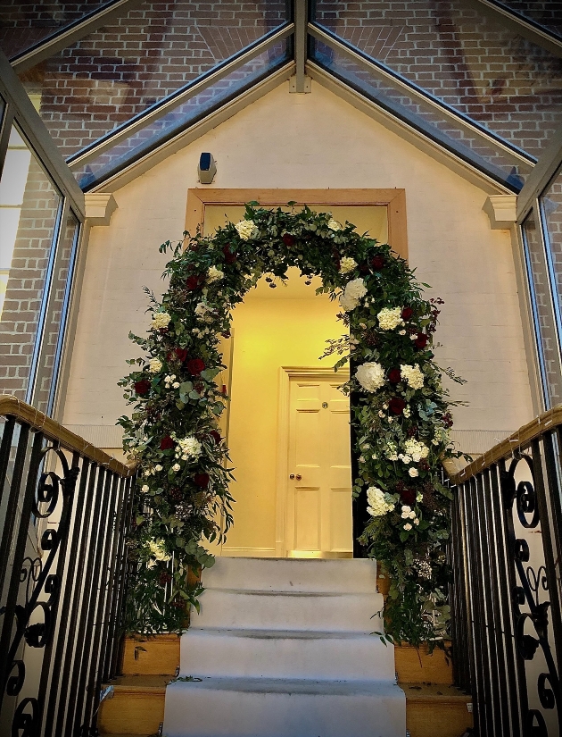 floral arch over the stairs 