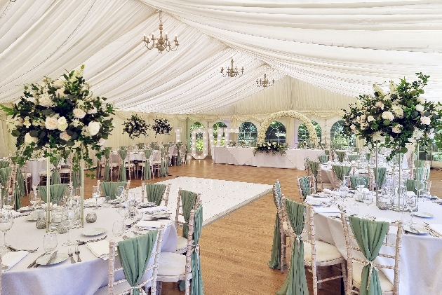 marquee with chandeliers and wedding reception tables
