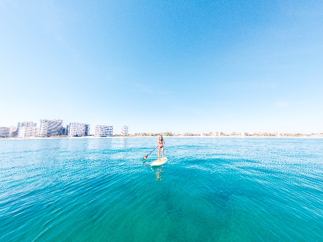 Woman paddle boarding