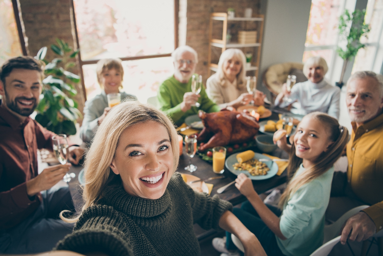 family taking selfie whilst having lunch