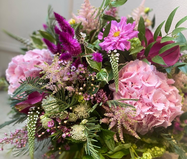 close up of bunch of summer flowers pinks and purples
