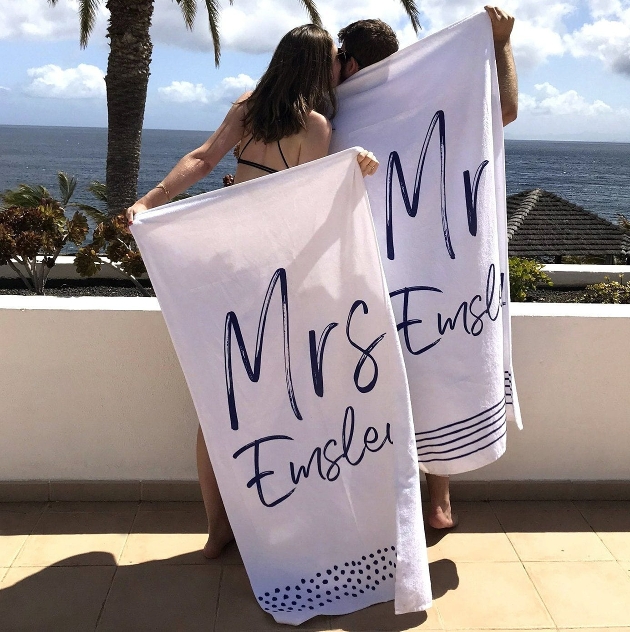 Beach towels with writing on. 