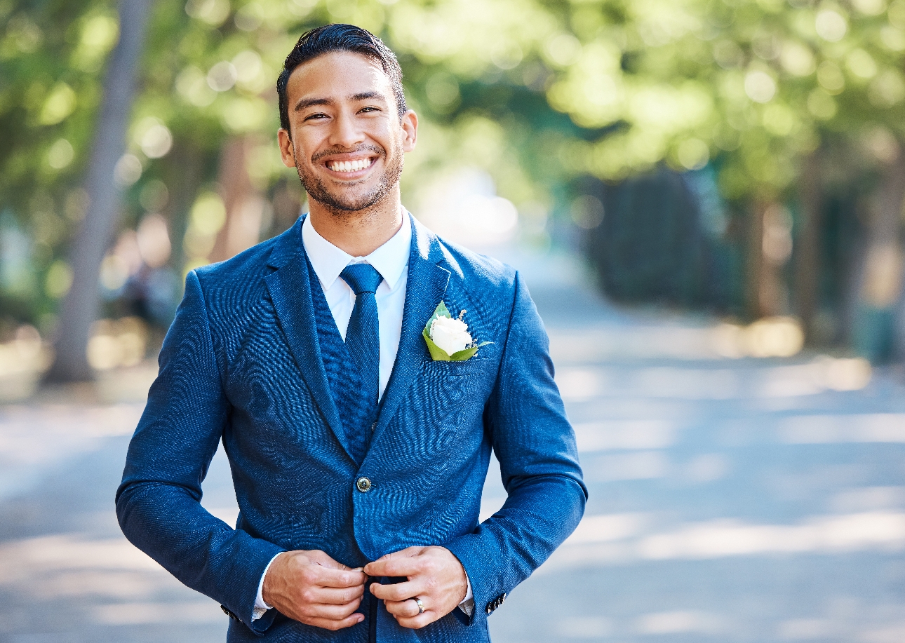 man in blue suit smiling