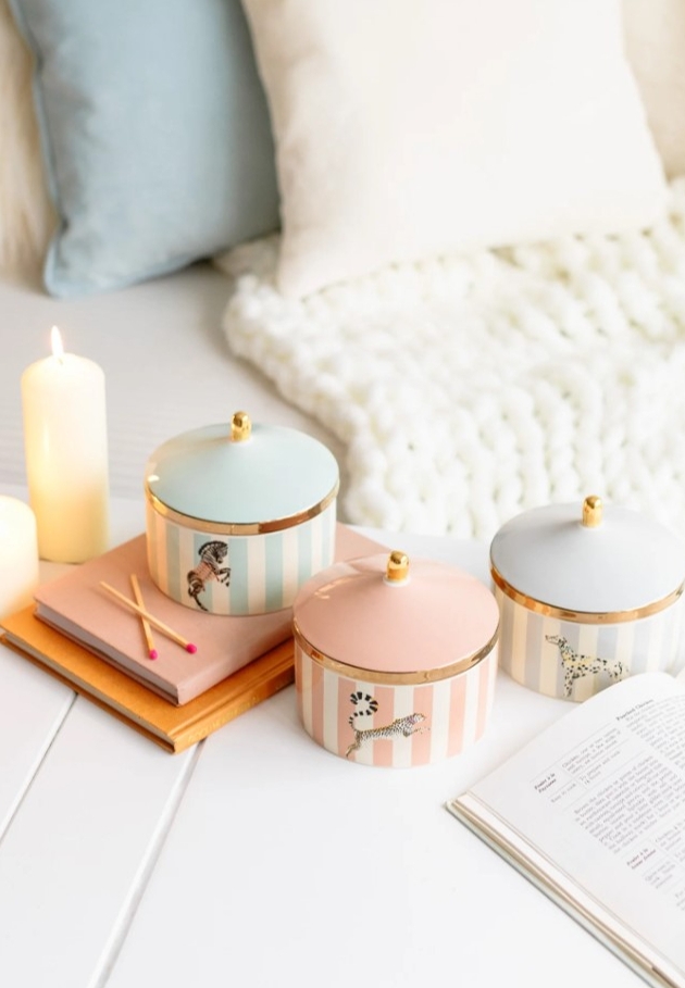 three candles in pastel colours