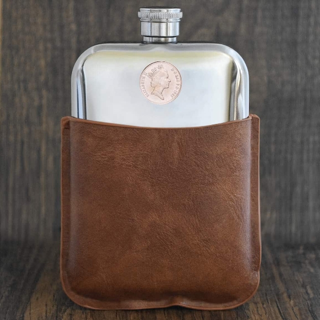 silver flask in leather pouch