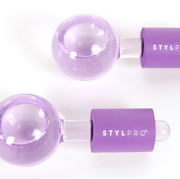 Purple balls with clear handles on a white background. 