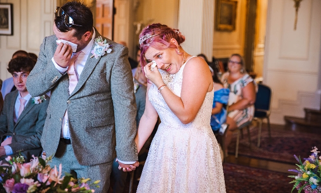 bride and groom crying at ceremony