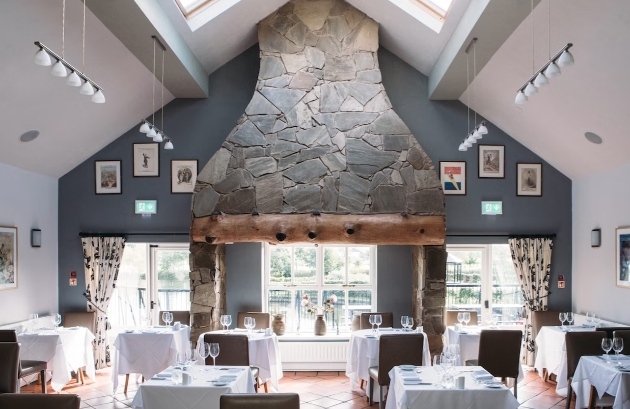 light and airy restaurant with a large stone column in centre