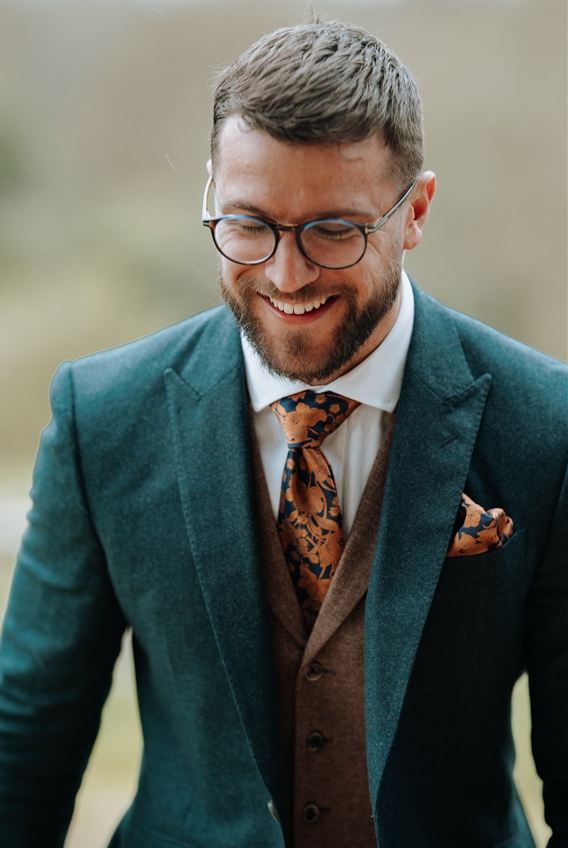close up image of model in green suit
