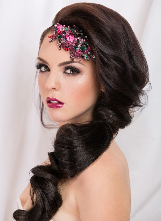 model with floral head band and loose gathered low bun