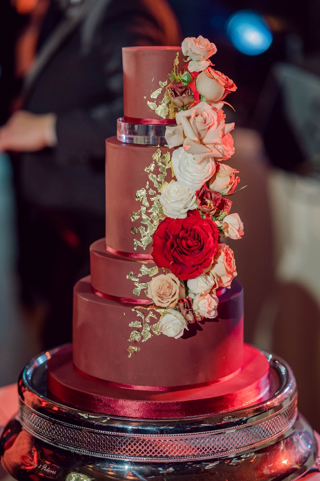 chocolate cake with red and white flowers