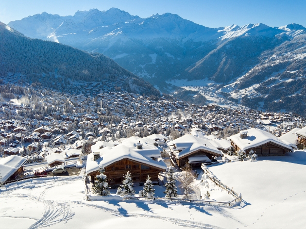 A sky view of a skiing resort covered in snow