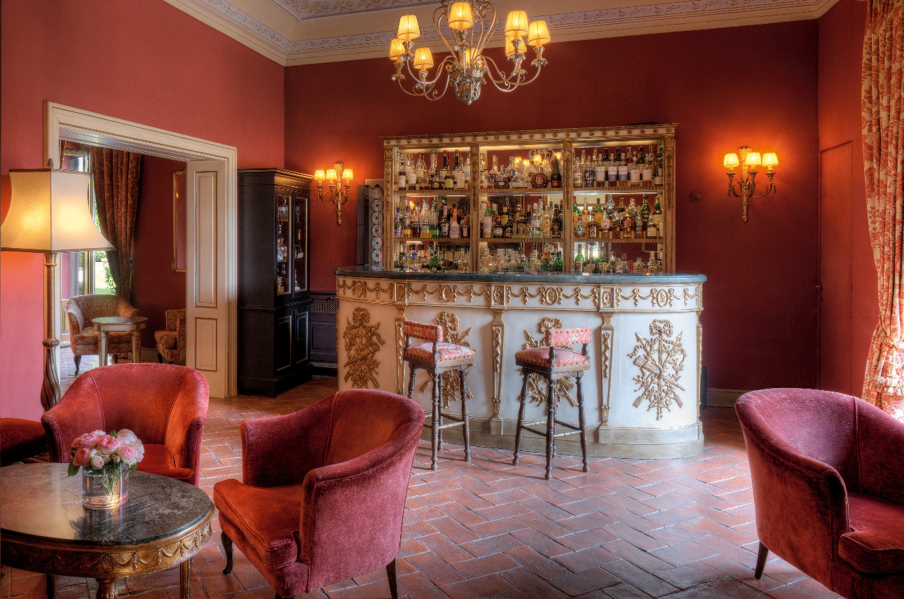 red room with ornate furnishings bar areas red velvet chairs