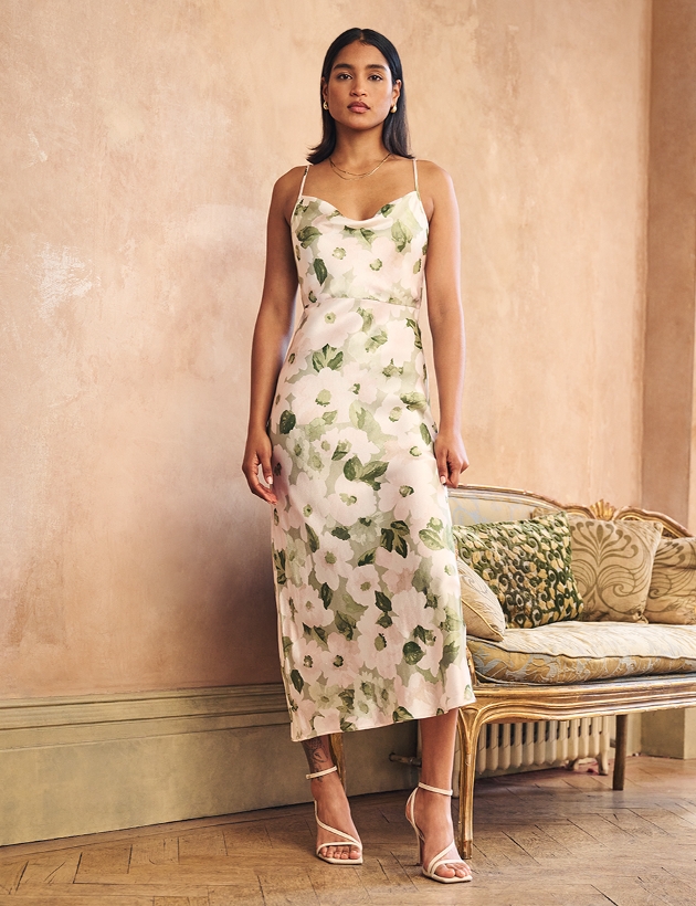 model in white and green flower dress